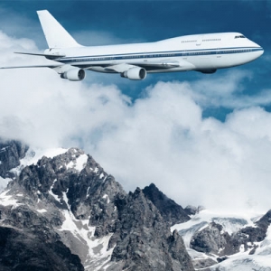 plane flying over mountains