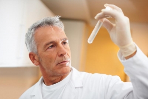 scentist looking at a test tube