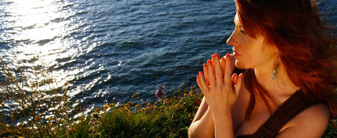 woman thinking by water