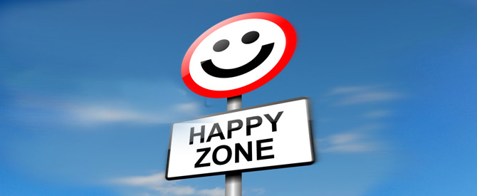 Smiling happy face sign with happy zone written beneath it.