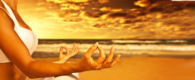 meditating woman on the beach