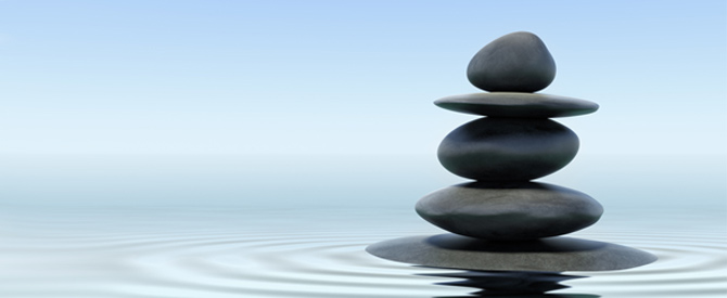 zen stones with water rippling around