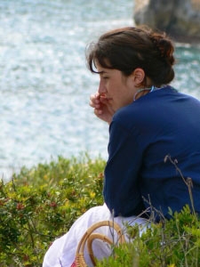 woman-sitting-In-deep-thought-by-lake