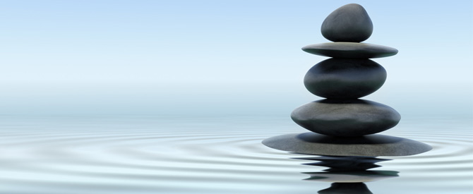 black zen stones stack in water