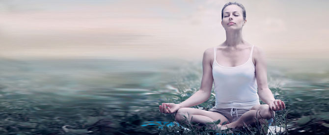 peaceful women meditating in the forest