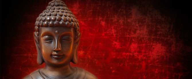 serene Buddha statue on red background