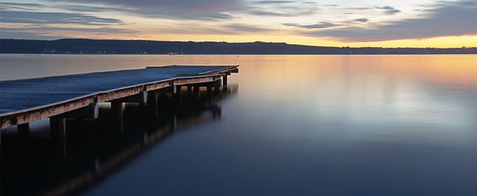 Jetty over still lake