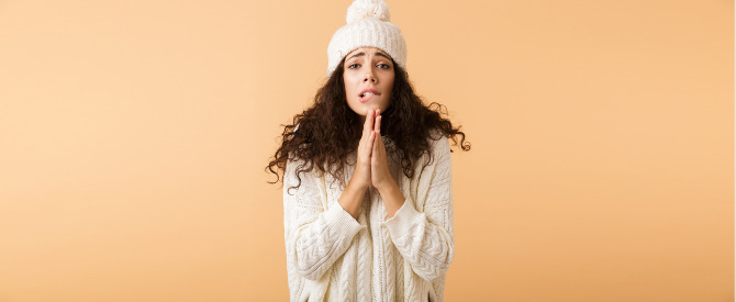 worried woman with hands in prayer position begging for something