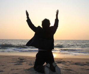 man on his knees in surrender