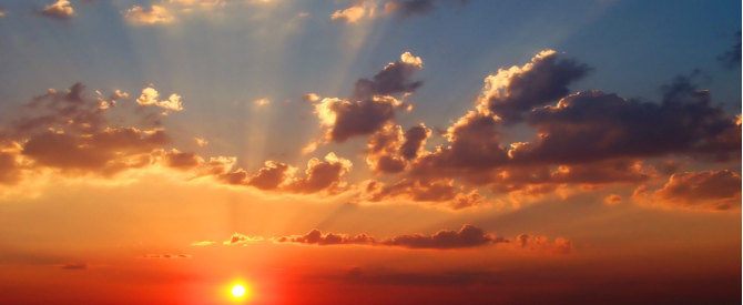 Golden sunrise and rays in the clouds