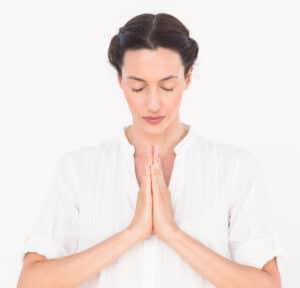 Woman praying to the Self as the highest spiritual discipline