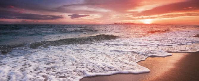 Beautiful ocean waves on a backdrop of a spectacular orange sunset as a means to recognize God.