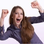 Exhilarated woman with fists up illustrating transform how to see your life