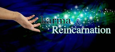 hands strewing cosmic dust with words karma and reincarnation showing inner wealth accumulated over lifetimes