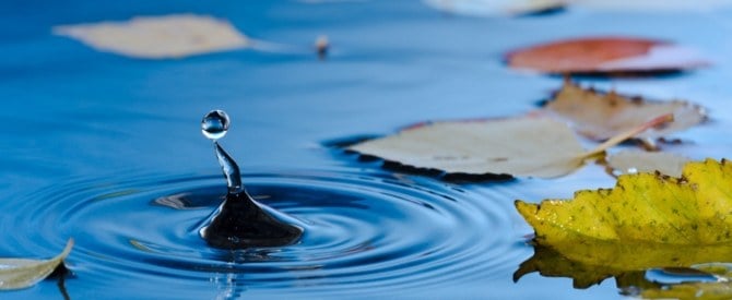 Water droplet bouncing out of the water representing how to measure your inner growth.