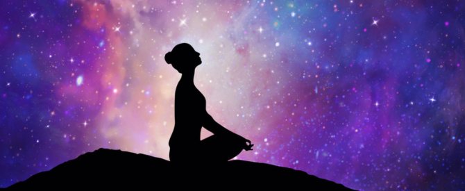 Woman silhouette in yoga lotus pose looking up to the stars as though asking God to fulfill your desires.