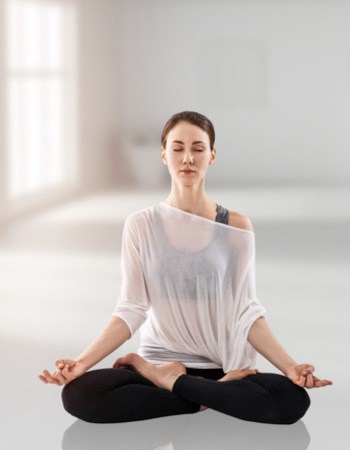 Woman sitting in meditation observing her thoughts