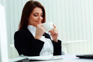 Woman enjoying coffee and unknowingly creating vasanas for it
