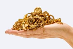 A handful of golden ornaments symbolisng how to find God that is one in the world of multifarious names and forms.